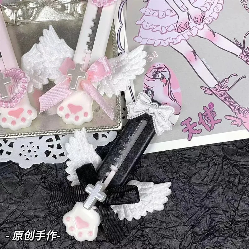 Niedliches Allzweckmesser mit Katzenpfote und reizendem Flügel im Bowknot-Stil, Kartonschneider, Briefumschlagöffner, Postmesser, Schul- und Bürobedarf