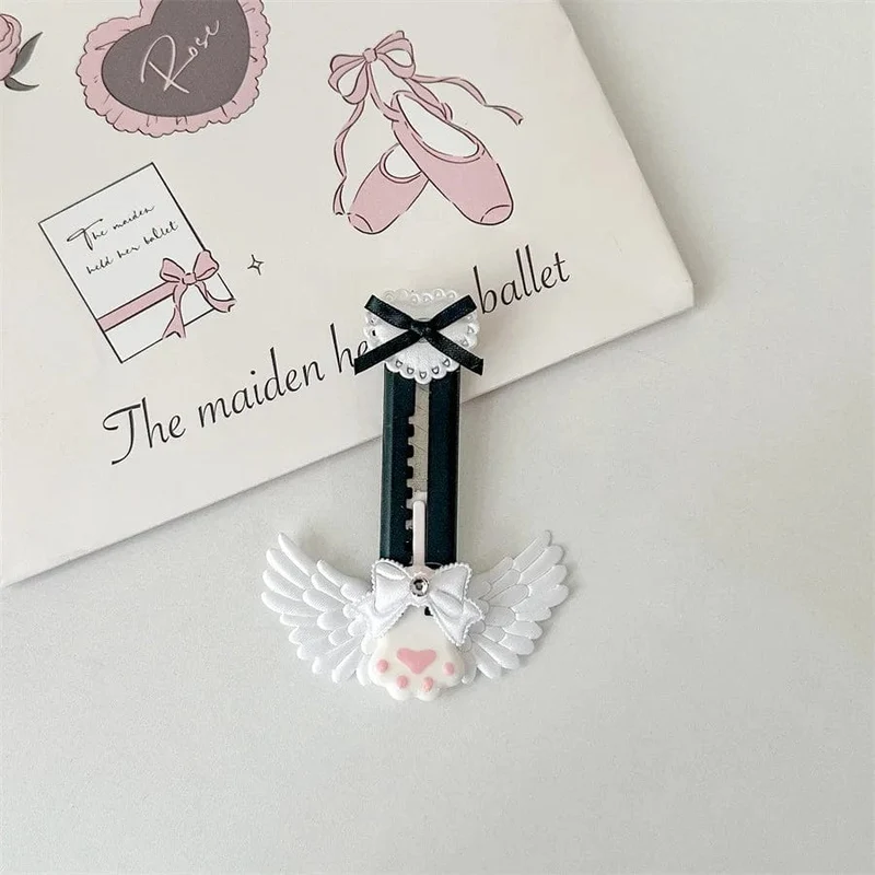 Niedliches Allzweckmesser mit Katzenpfote und reizendem Flügel im Bowknot-Stil, Kartonschneider, Briefumschlagöffner, Postmesser, Schul- und Bürobedarf