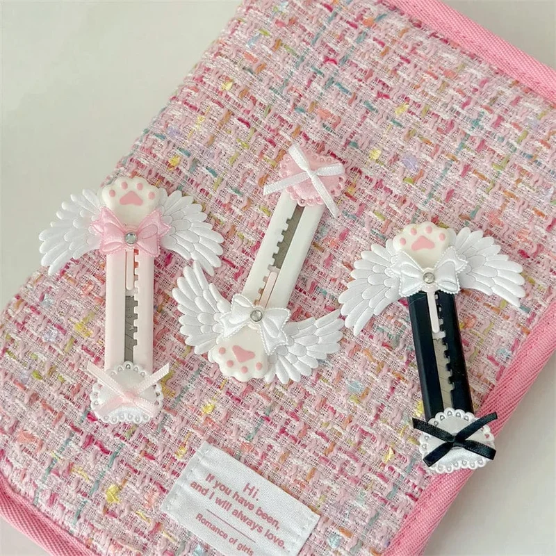 Niedliches Allzweckmesser mit Katzenpfote und reizendem Flügel im Bowknot-Stil, Kartonschneider, Briefumschlagöffner, Postmesser, Schul- und Bürobedarf