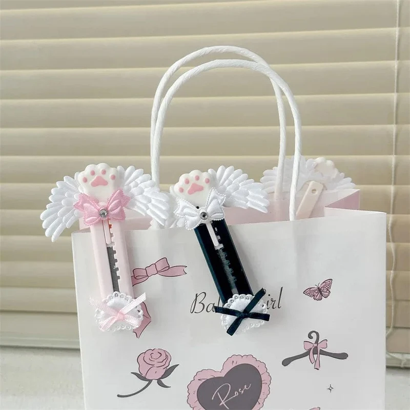 Niedliches Allzweckmesser mit Katzenpfote und reizendem Flügel im Bowknot-Stil, Kartonschneider, Briefumschlagöffner, Postmesser, Schul- und Bürobedarf