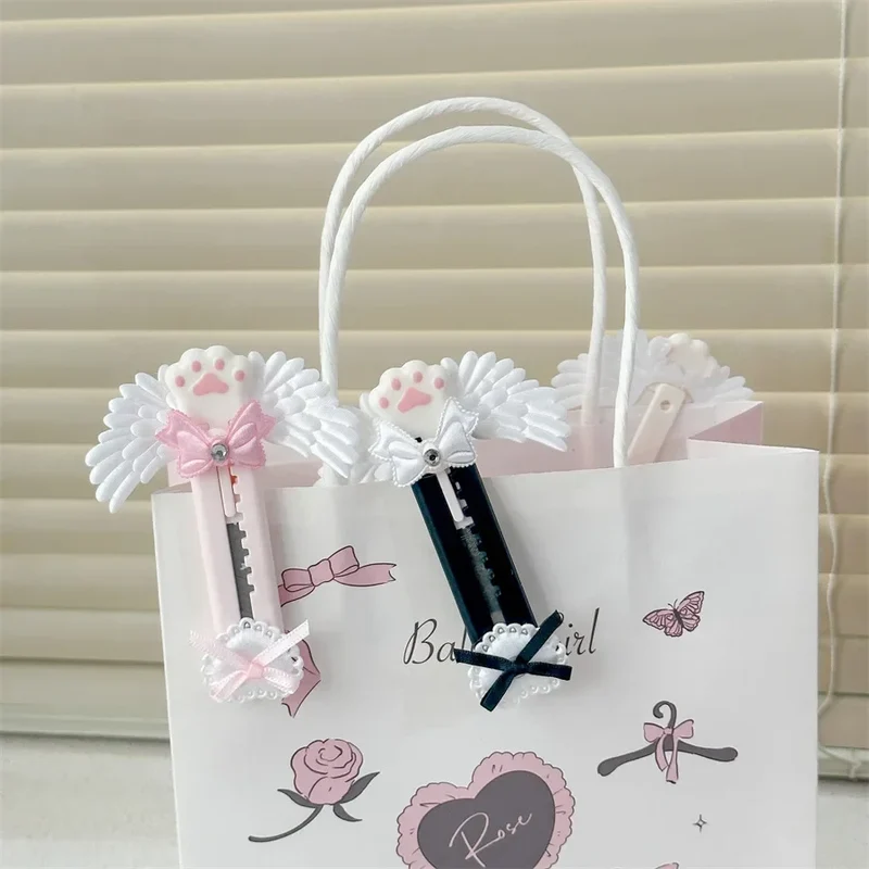 Niedliches Allzweckmesser mit Katzenpfote und reizendem Flügel im Bowknot-Stil, Kartonschneider, Briefumschlagöffner, Postmesser, Schul- und Bürobedarf