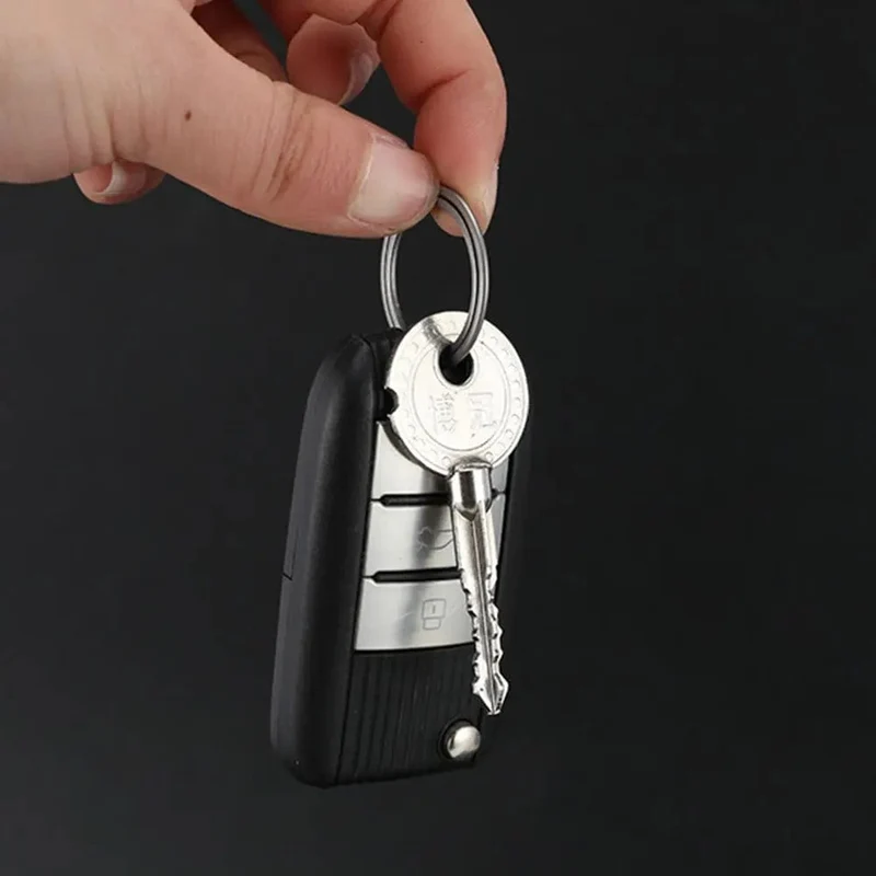 1 Stück Neuer Titan-Schlüsselring Superleichte Schlüsselanhänger Schnalle Anhänger Mann Auto Schlüsselanhänger Männliche Kreativität Geschenk Outdoor-Tool