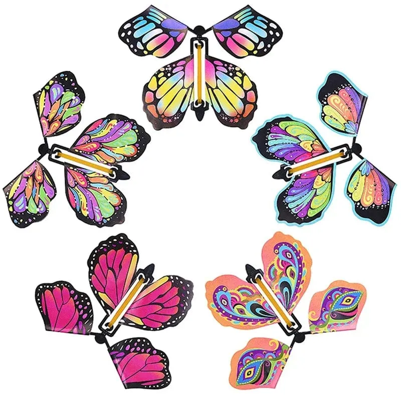 5 Stücke Magisches fliegendes Schmetterlings-Aufziehspielzeug im Himmel Lustige Gummiband-betriebene Karten Kindertricks Requisiten Party Tolles Überraschungsgeschenk