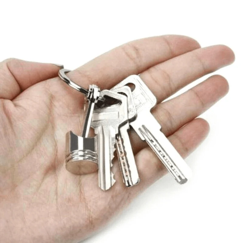 Kreativer Schlüsselanhänger mit Kolbenmodell aus Metall: Ein stilvoller Schlüsselanhänger für Autoliebhaber!