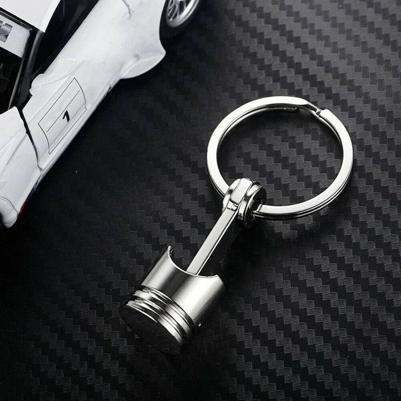 Kreativer Schlüsselanhänger mit Kolbenmodell aus Metall: Ein stilvoller Schlüsselanhänger für Autoliebhaber!