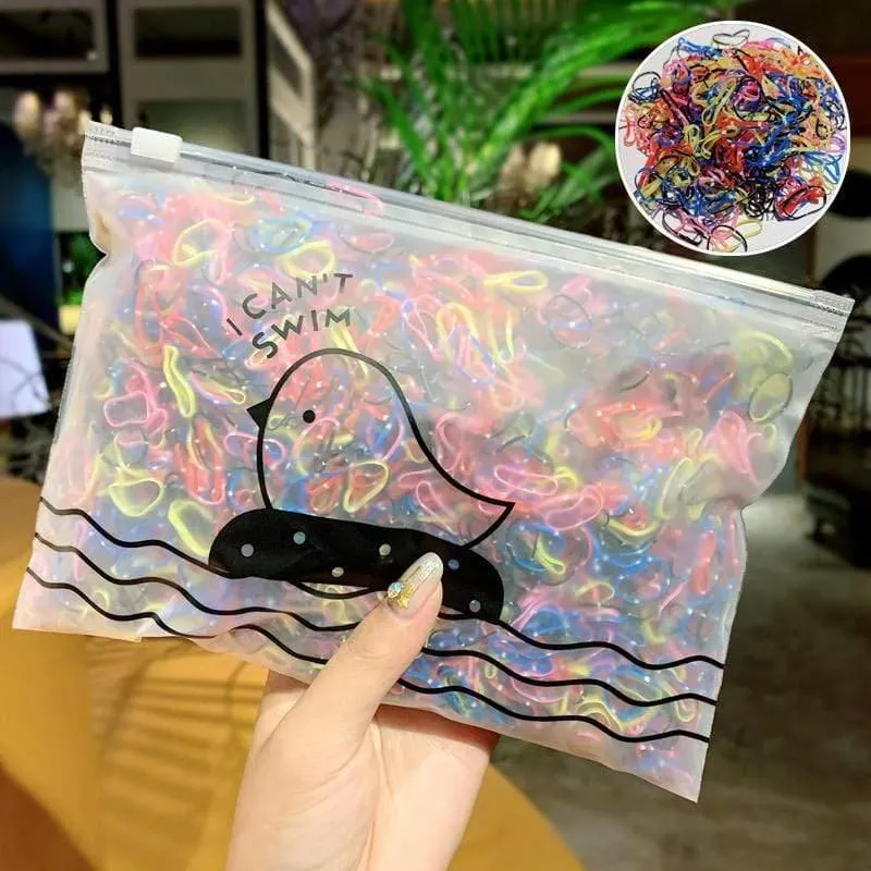 1000 Stück / Packung Mädchen Bunte kleine Einweg-Gummibänder Kinder Pferdeschwanzhalter Elastische Haarbänder Krawatten Mode Haarschmuck