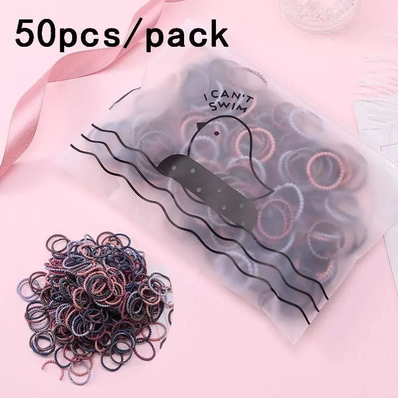 1000 Stück / Packung Mädchen Bunte kleine Einweg-Gummibänder Kinder Pferdeschwanzhalter Elastische Haarbänder Krawatten Mode Haarschmuck