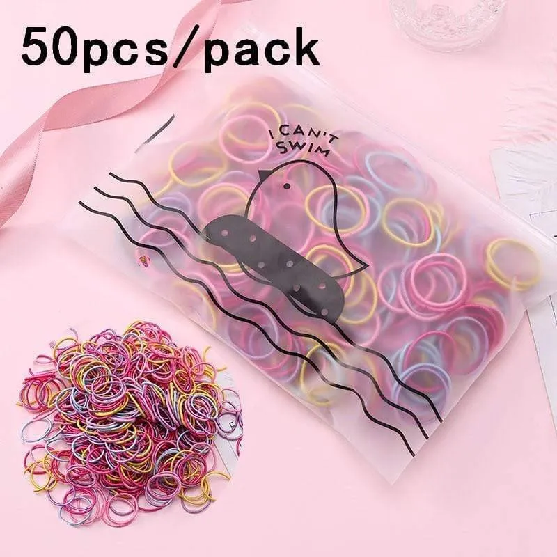 1000 Stück / Packung Mädchen Bunte kleine Einweg-Gummibänder Kinder Pferdeschwanzhalter Elastische Haarbänder Krawatten Mode Haarschmuck