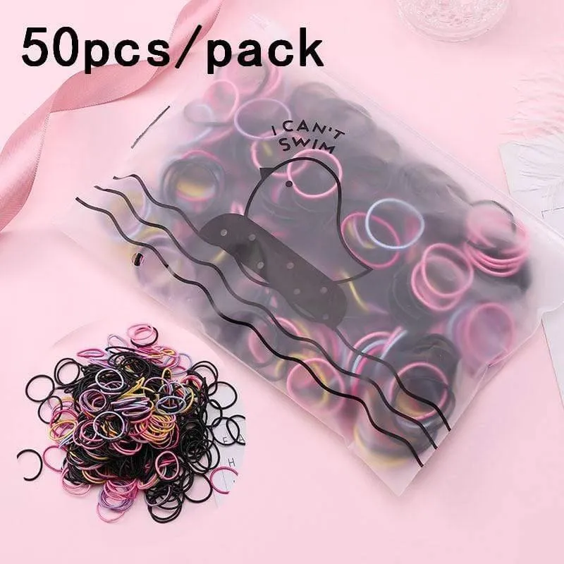 1000 Stück / Packung Mädchen Bunte kleine Einweg-Gummibänder Kinder Pferdeschwanzhalter Elastische Haarbänder Krawatten Mode Haarschmuck