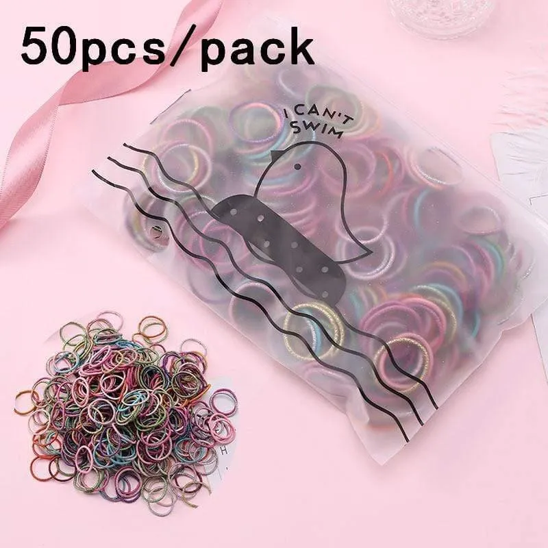 1000 Stück / Packung Mädchen Bunte kleine Einweg-Gummibänder Kinder Pferdeschwanzhalter Elastische Haarbänder Krawatten Mode Haarschmuck