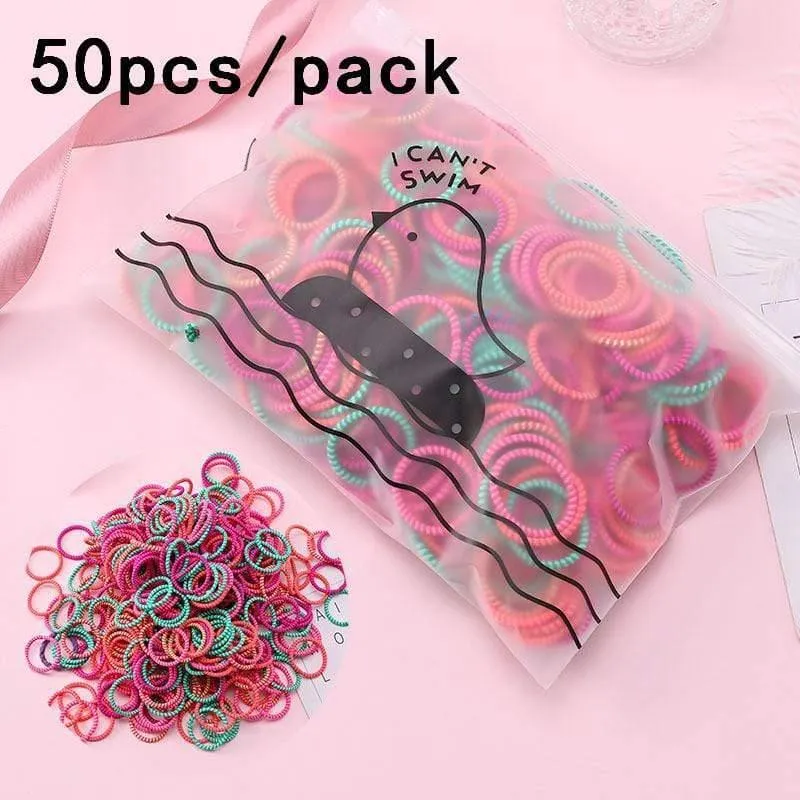 1000 Stück / Packung Mädchen Bunte kleine Einweg-Gummibänder Kinder Pferdeschwanzhalter Elastische Haarbänder Krawatten Mode Haarschmuck