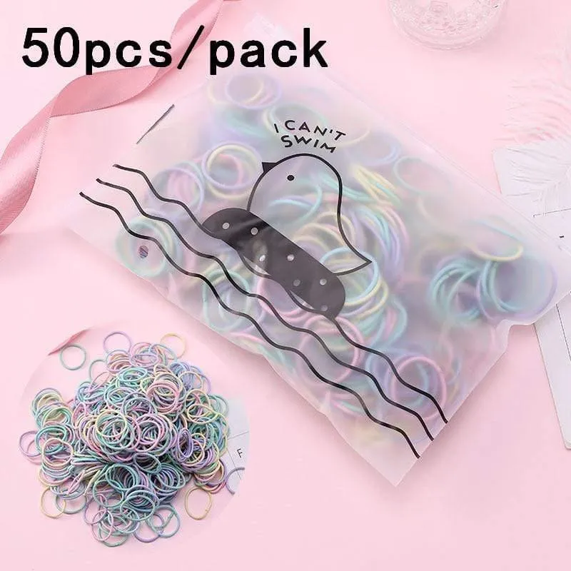 1000 Stück / Packung Mädchen Bunte kleine Einweg-Gummibänder Kinder Pferdeschwanzhalter Elastische Haarbänder Krawatten Mode Haarschmuck