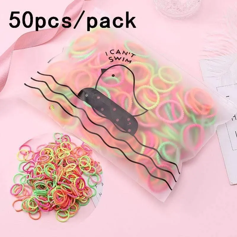 1000 Stück / Packung Mädchen Bunte kleine Einweg-Gummibänder Kinder Pferdeschwanzhalter Elastische Haarbänder Krawatten Mode Haarschmuck