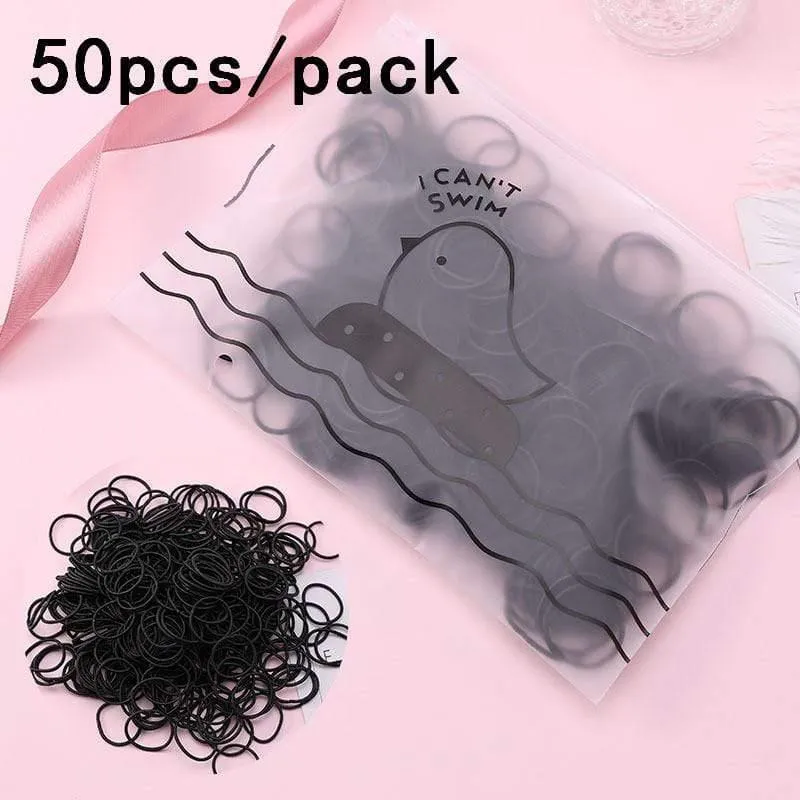 1000 Stück / Packung Mädchen Bunte kleine Einweg-Gummibänder Kinder Pferdeschwanzhalter Elastische Haarbänder Krawatten Mode Haarschmuck