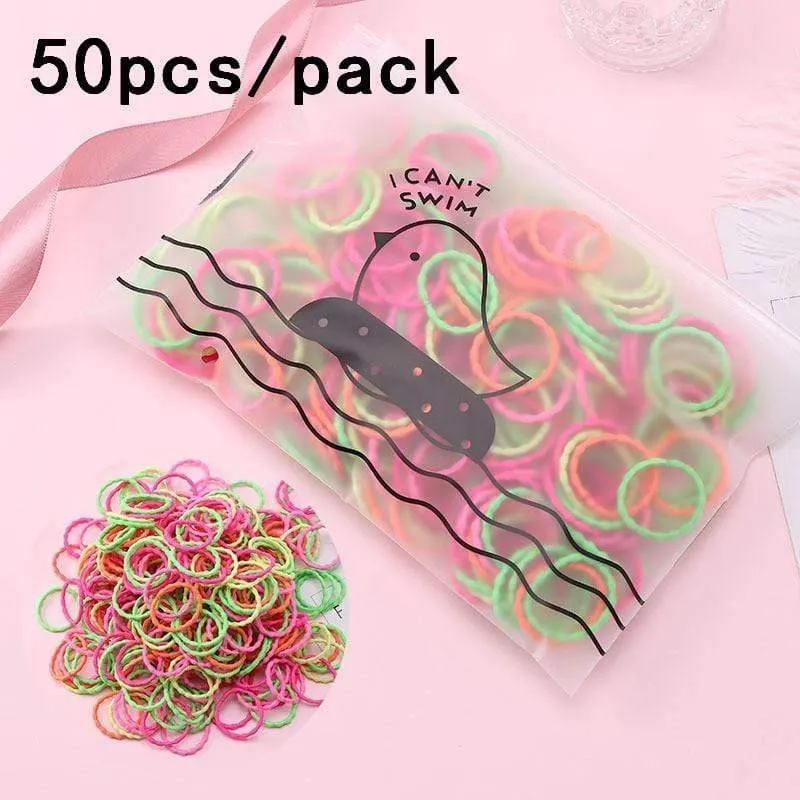 1000 Stück / Packung Mädchen Bunte kleine Einweg-Gummibänder Kinder Pferdeschwanzhalter Elastische Haarbänder Krawatten Mode Haarschmuck